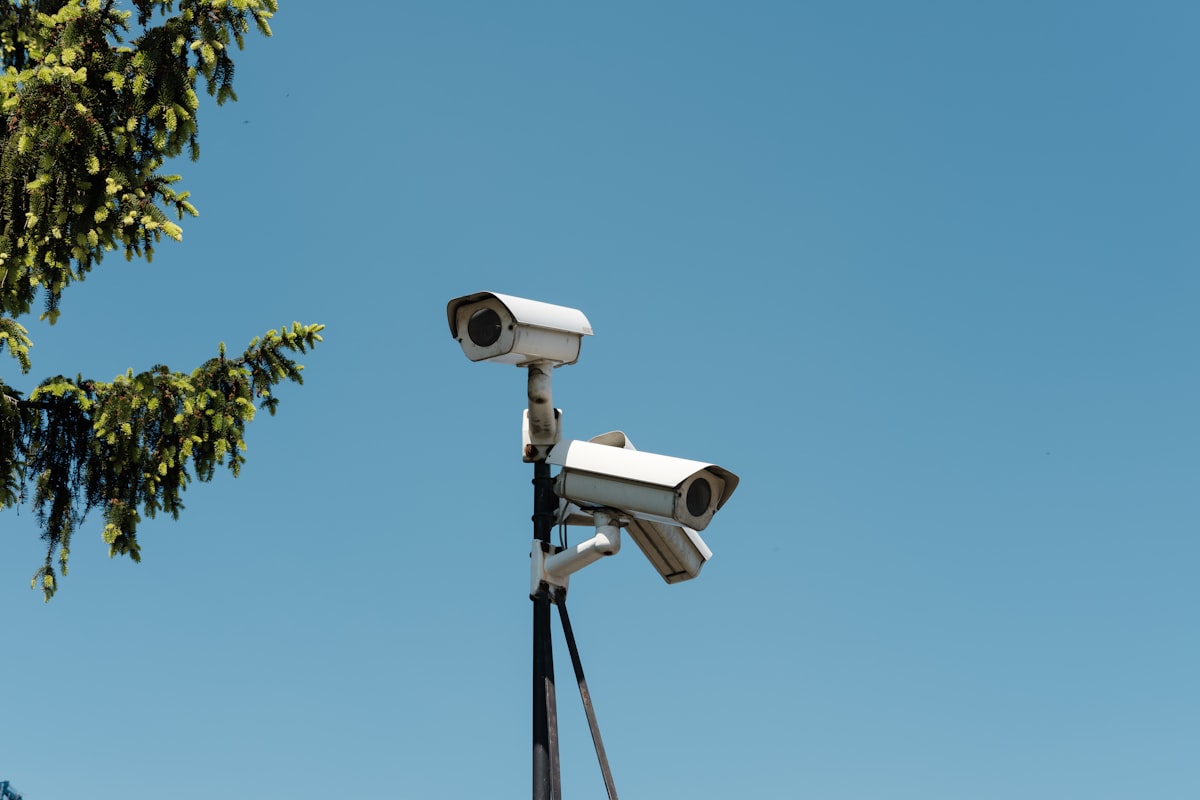 surveillance - white and black camera on tripod